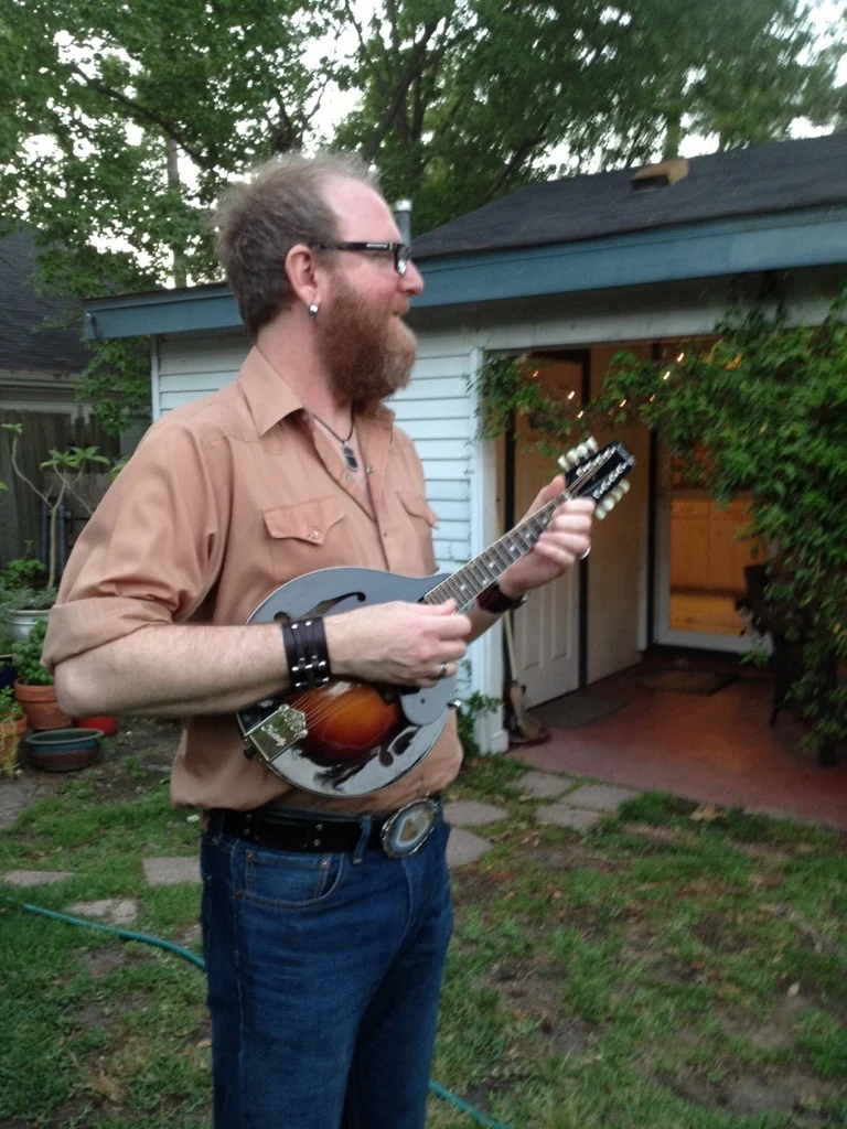 Eric Jarvis playing mandolin outdoors